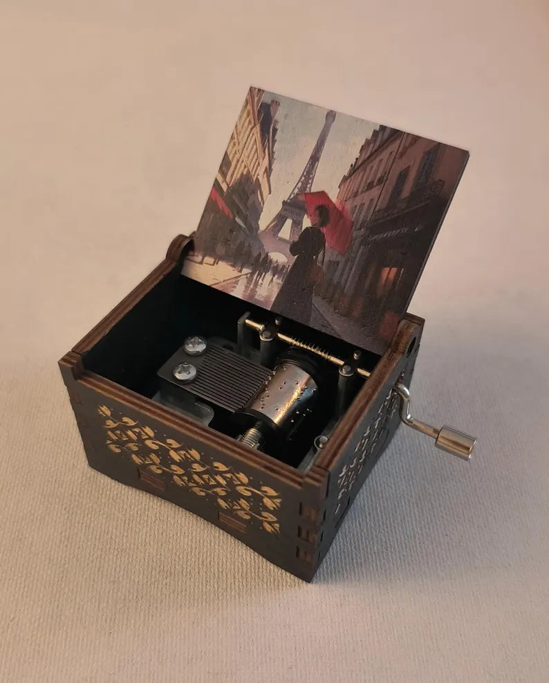 Hand crank music box playing the song Amélie’s Waltz. La valse d'amlie