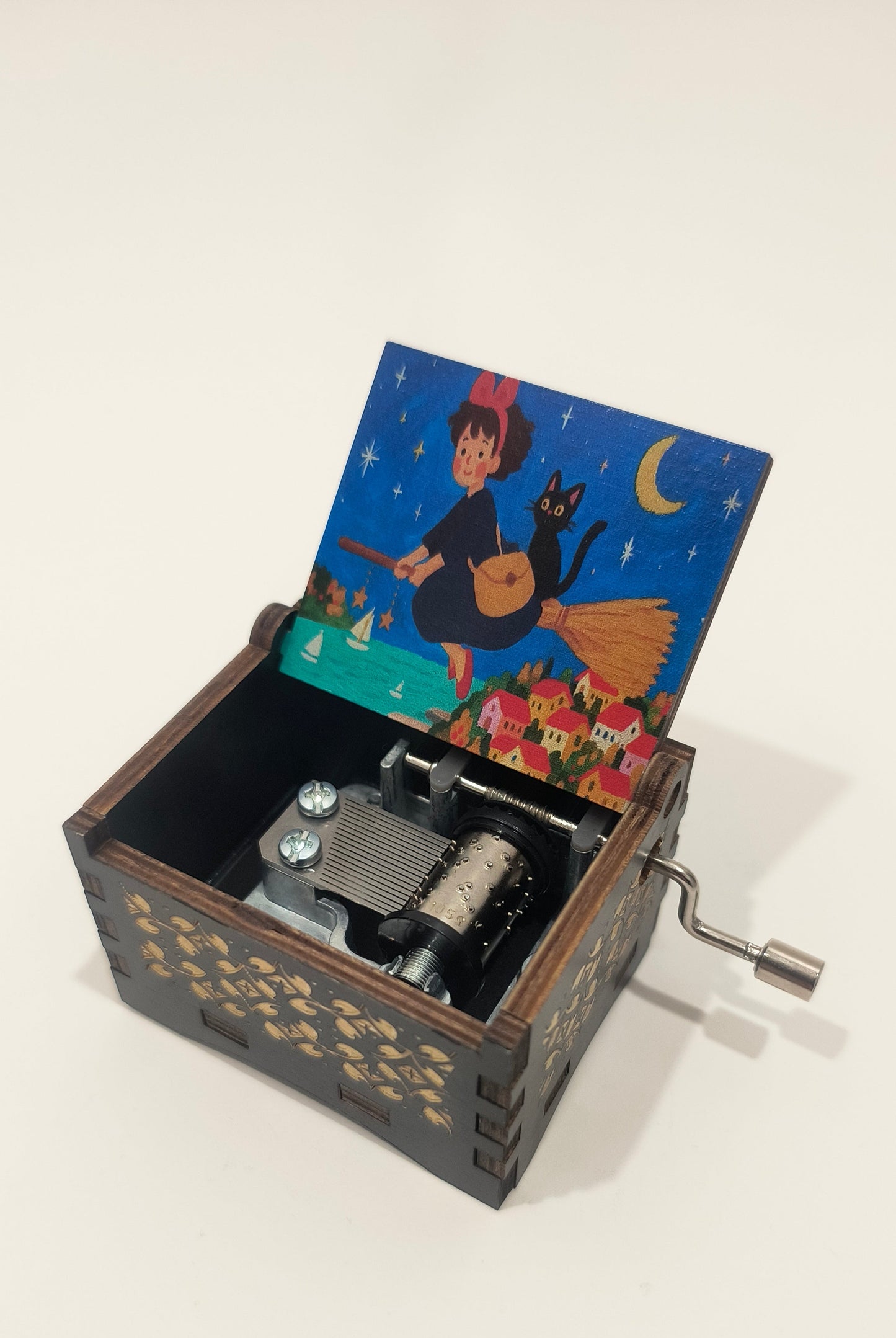 Music box with a colorful card inside on a white background