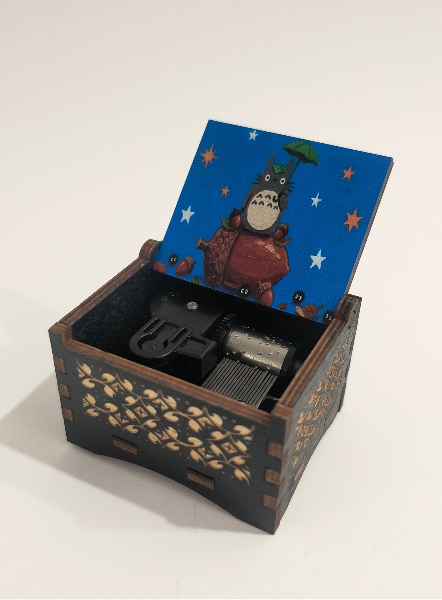 Decorative wooden box with a lid featuring cartoon characters on a white background