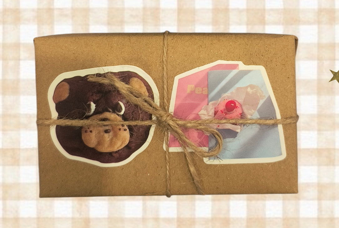 Folded fabric with heart cutout and tied with twine on a checkered background